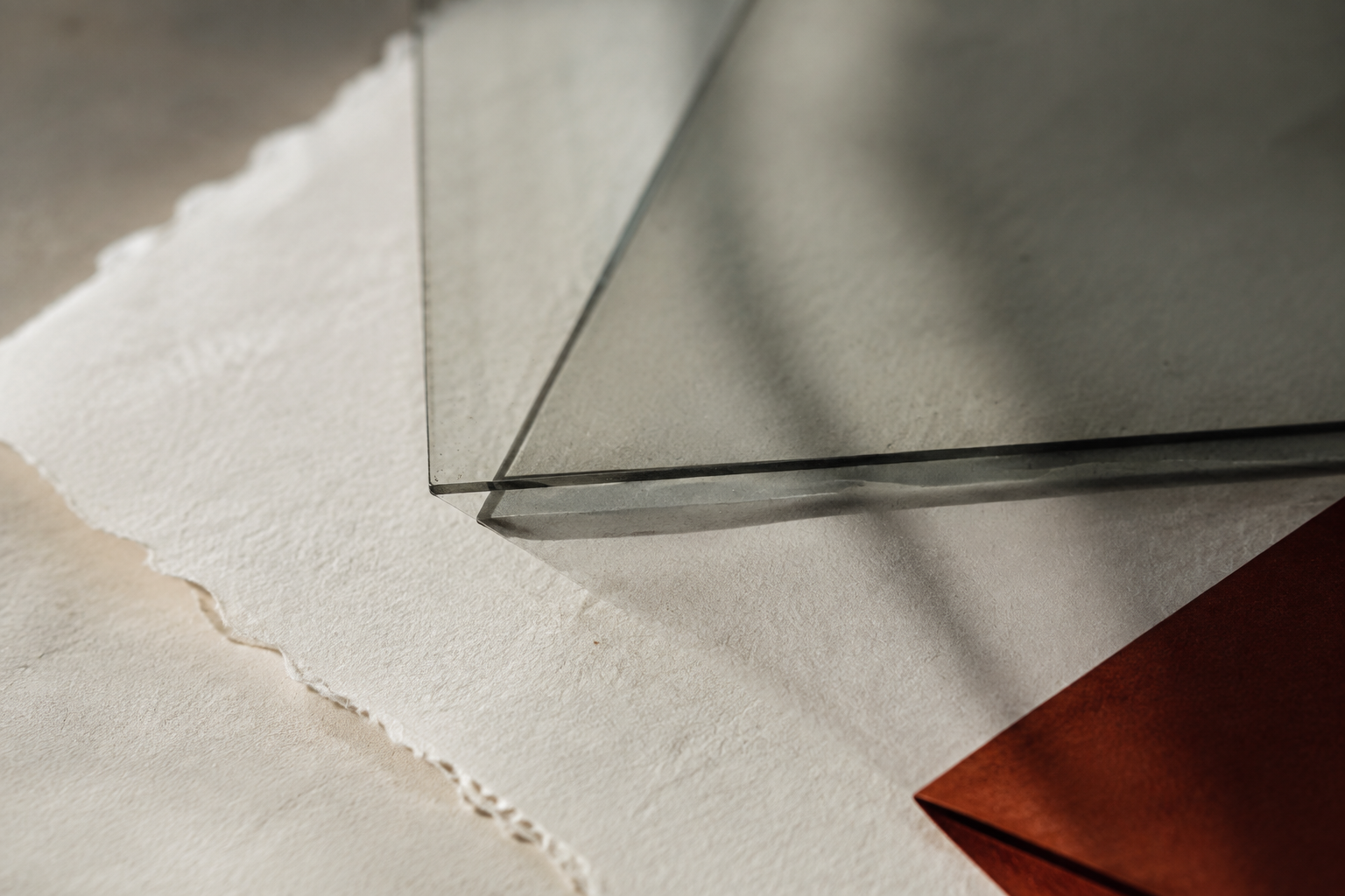 Editorial study of paper, glass and warm light